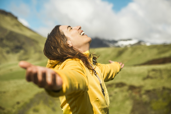 Woman contemplating a beautiful landscape